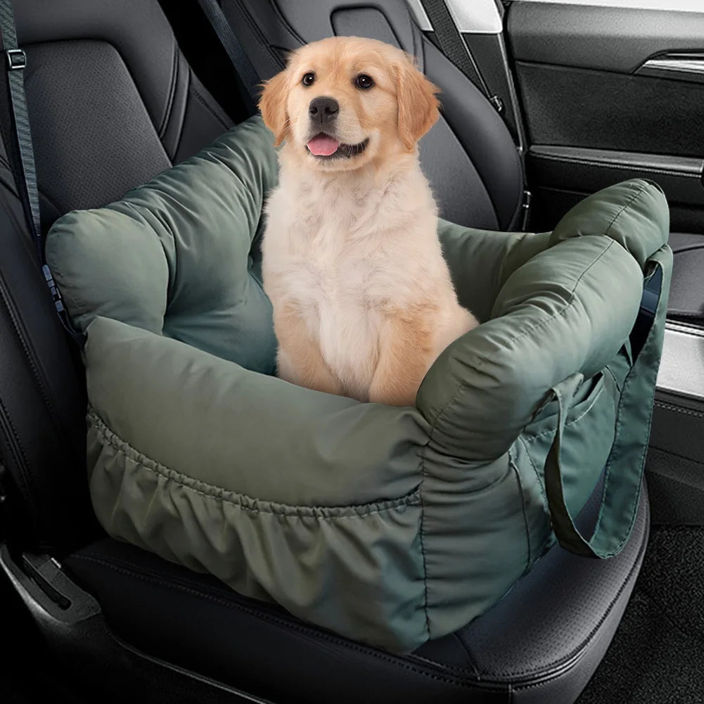 Dog sitting in a green car seat booster in a vehicle