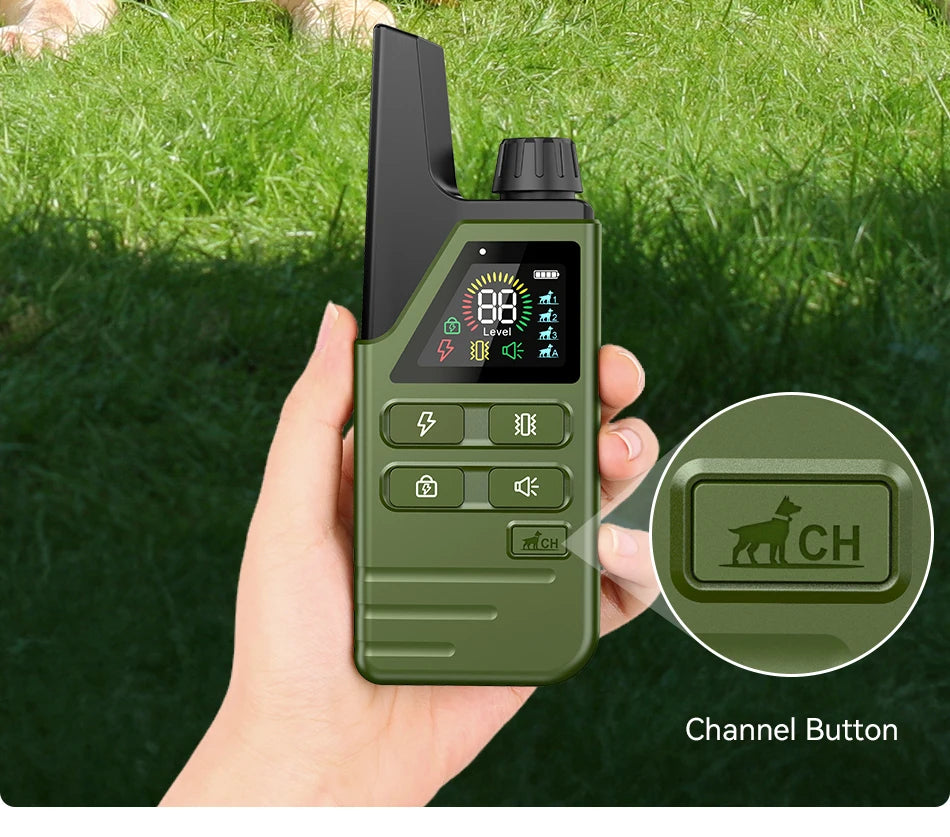 Green electronic device held in a hand with grass background